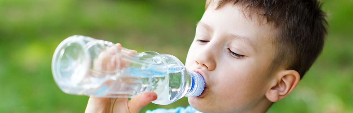 child-drinking-bottled-spring-water